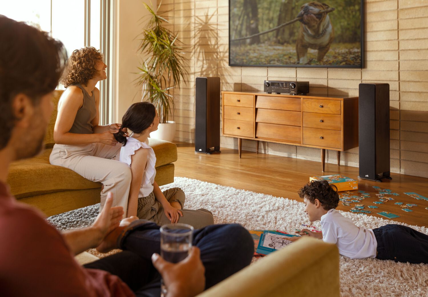 A family watching TV together